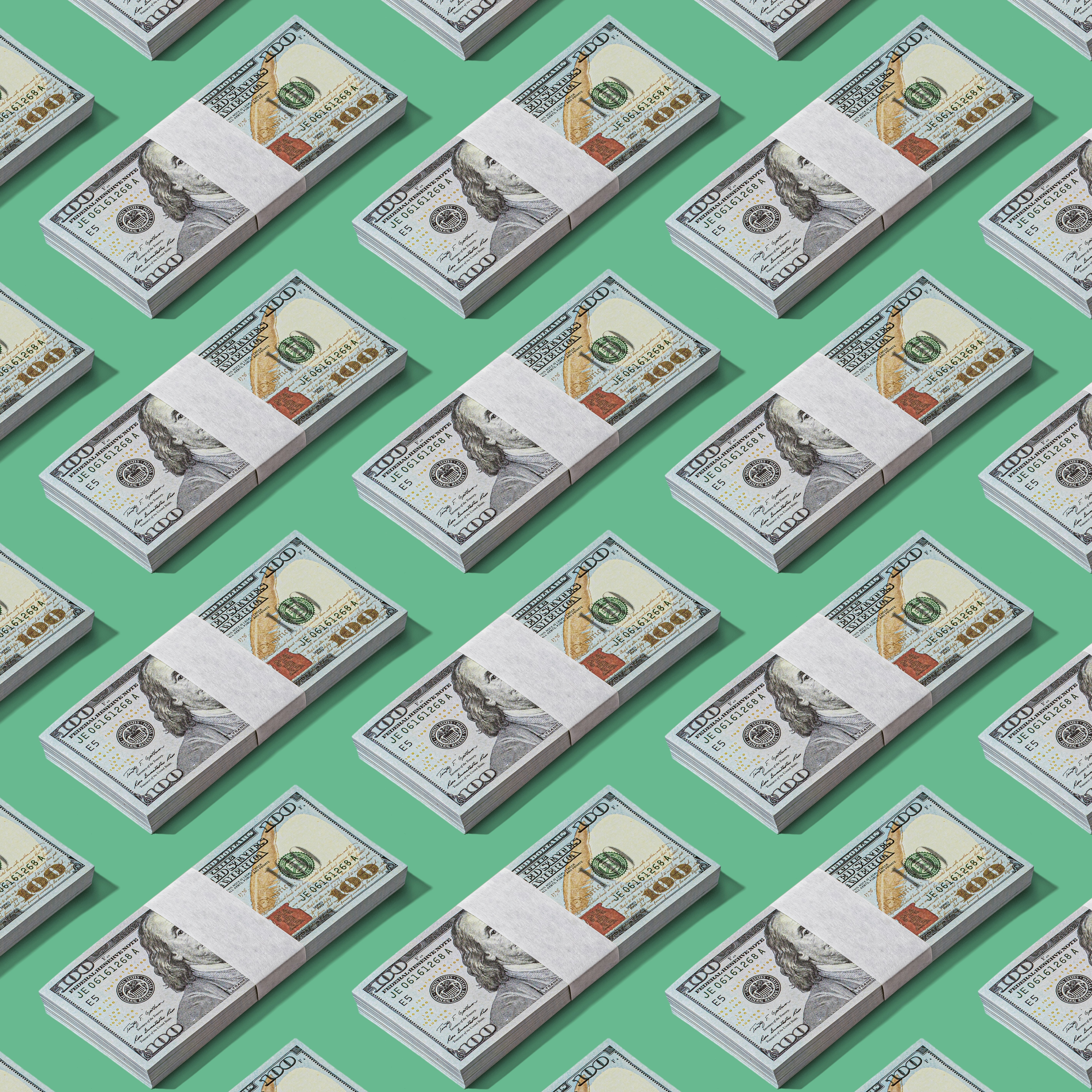 a lot of money sitting on top of a green surface